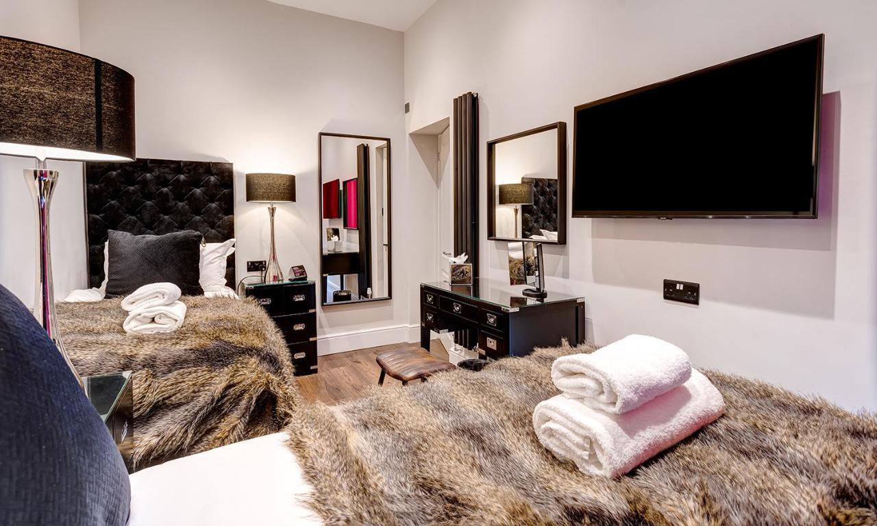 Kotel Windermere Exterior foto A bedroom at The Ivy Collection